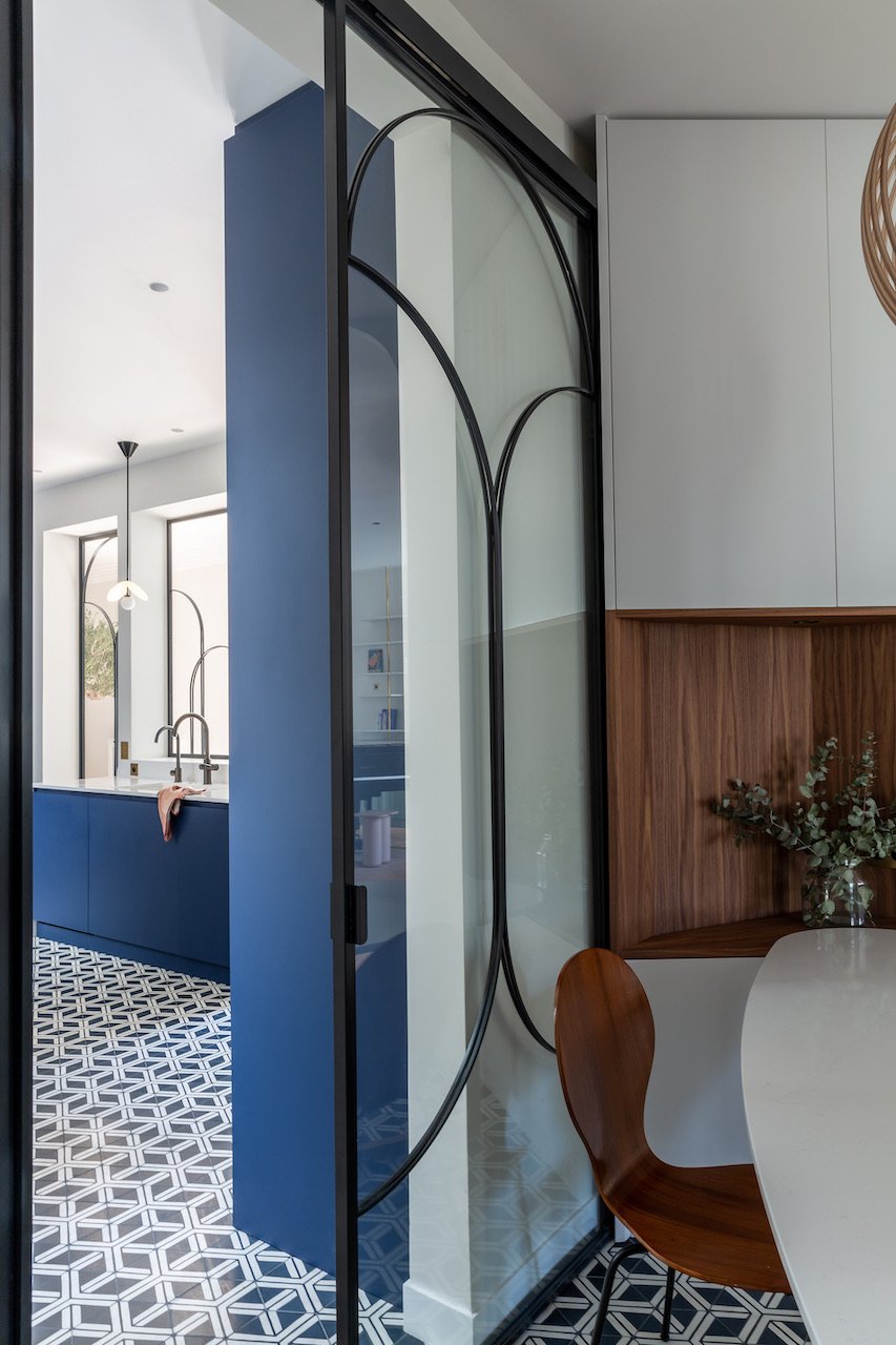Brass bookcase and glass partition — Paris 16th