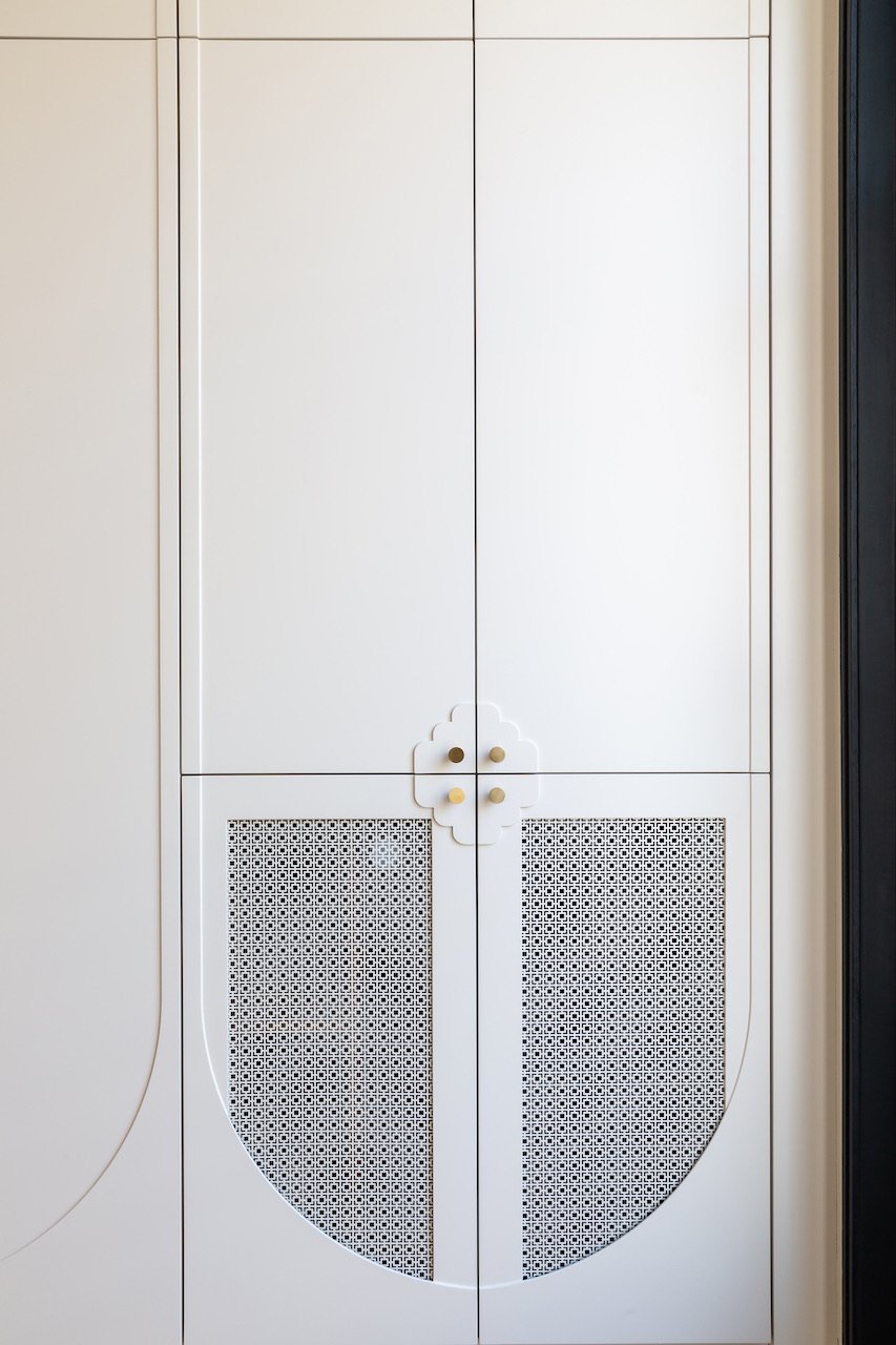 Fluted oak cupboard detail — Paris 16th