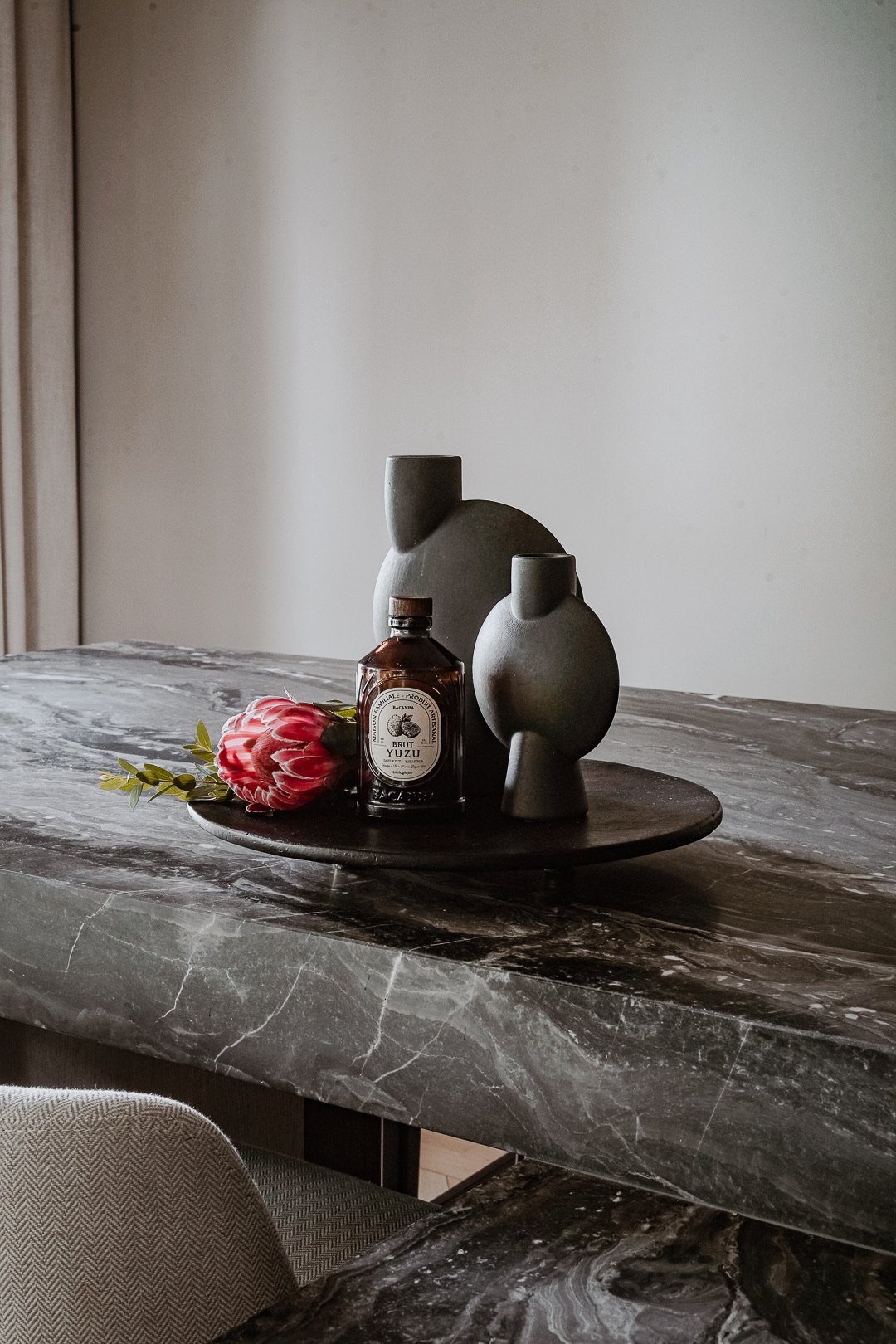 Dark grey marble tray and objects detail — Paris 7th