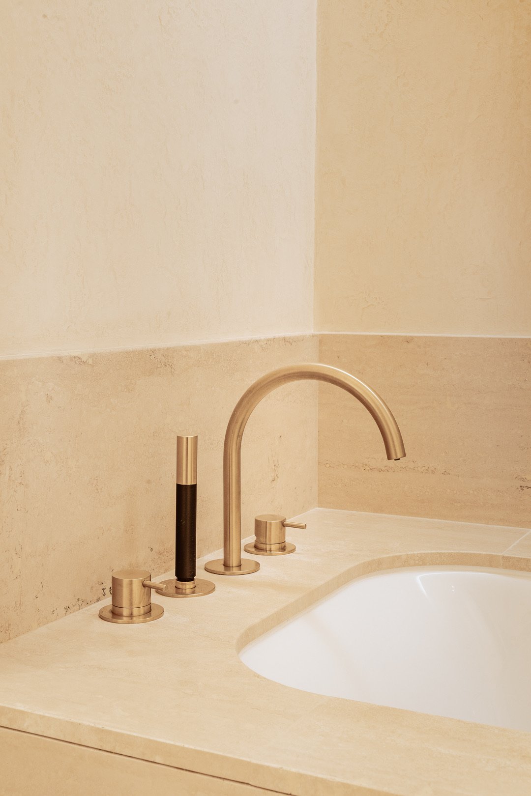 Travertine and brass shower — Paris 7th