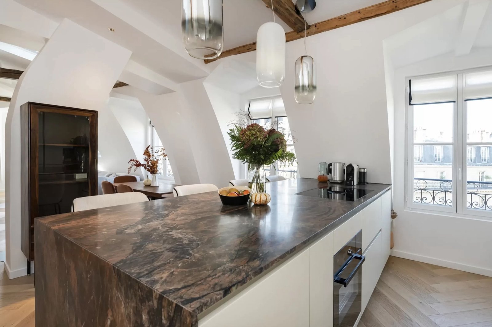 Kitchen brown marble island and pendants — Paris 17th